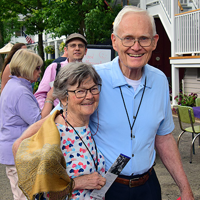 Couple smiling for photo dusing porch blessing dedication