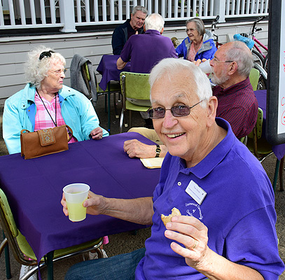 Tom Kerns and Matilda enjoying refreshments and conversation during porch blessing dedication